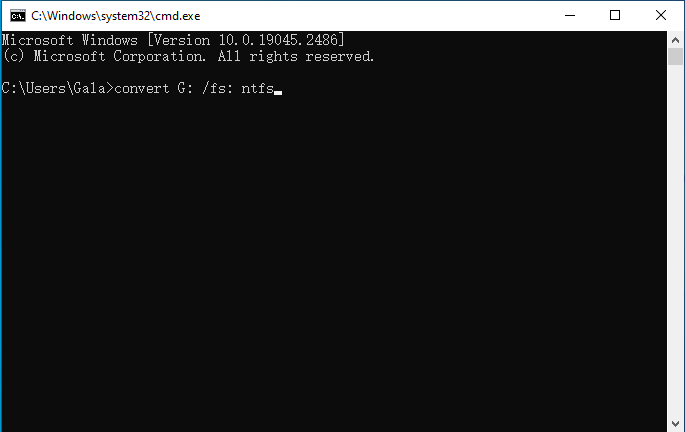 Type the command convert [drive letter]: /fs: ntfs and hit Enter